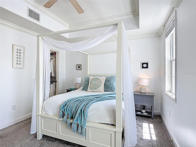 7509 Mourning Dove Cir Unit 203, Reunion, FL 34747 - bedroom with crown molding, baseboards, carpet, and visible vents
