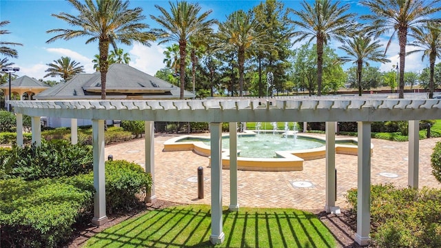 7509 Mourning Dove Cir Unit 203, Reunion, FL 34747 - exterior space featuring a pergola and an in ground hot tub