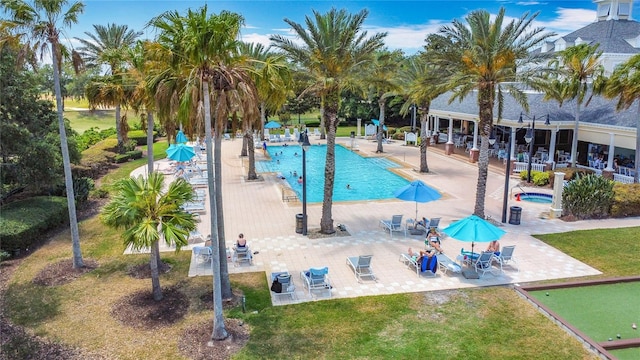 7509 Mourning Dove Cir Unit 203, Reunion, FL 34747 - pool with a patio area and a yard