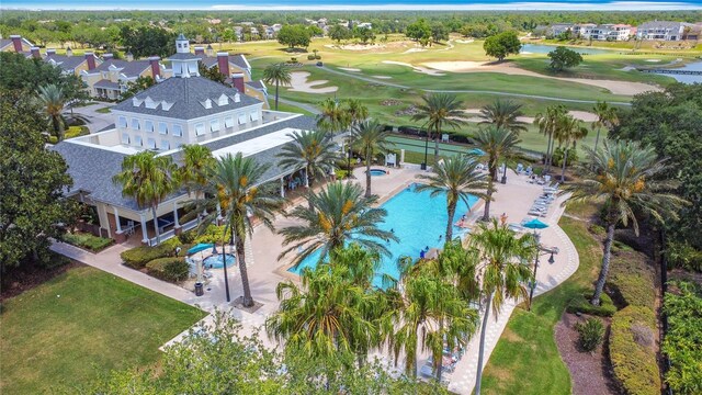 7509 Mourning Dove Cir Unit 203, Reunion, FL 34747 - drone / aerial view featuring a water view and golf course view