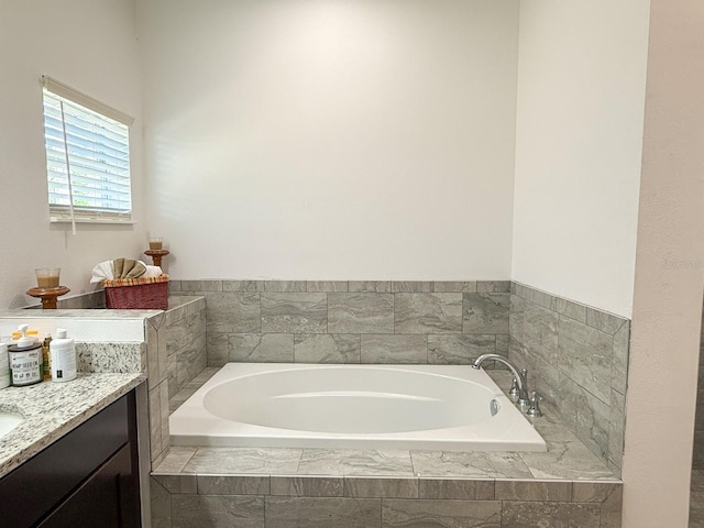 bathroom featuring a bath and vanity