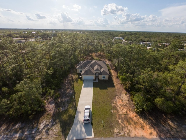 aerial view featuring a wooded view