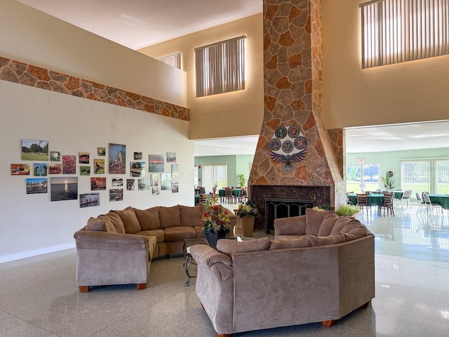 living area featuring a towering ceiling