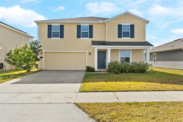 740 Simone Ct, Haines City, FL 33844 - traditional-style house featuring a garage, board and batten siding, a front yard, and concrete driveway