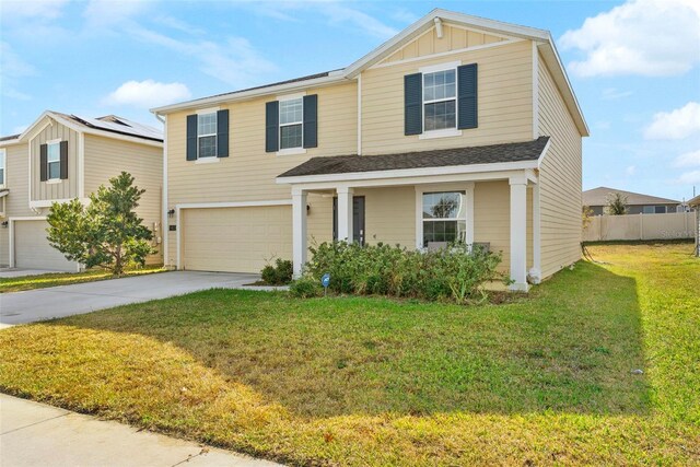 740 Simone Ct, Haines City, FL 33844 - traditional-style home with board and batten siding, driveway, a front yard, fence, and an attached garage