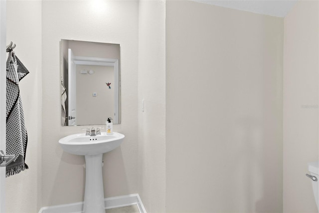 740 Simone Ct, Haines City, FL 33844 - bathroom featuring baseboards