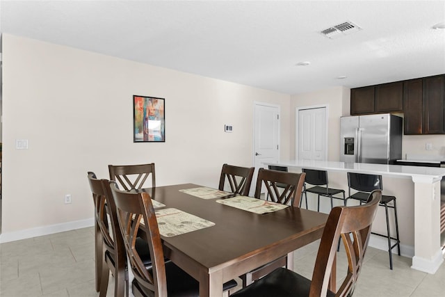 740 Simone Ct, Haines City, FL 33844 - dining space featuring baseboards, visible vents, and light tile patterned floors