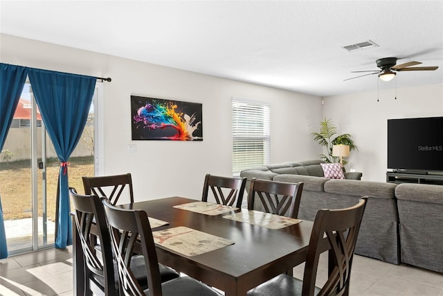 740 Simone Ct, Haines City, FL 33844 - dining space with light tile patterned floors, ceiling fan, and visible vents