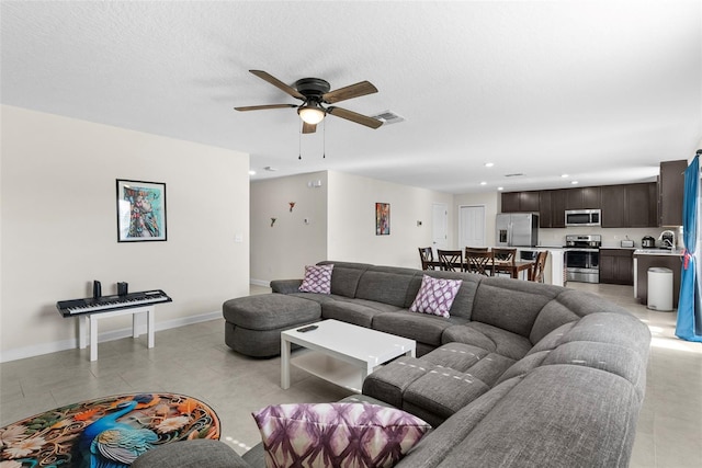740 Simone Ct, Haines City, FL 33844 - living room featuring a ceiling fan, visible vents, baseboards, recessed lighting, and light tile patterned flooring