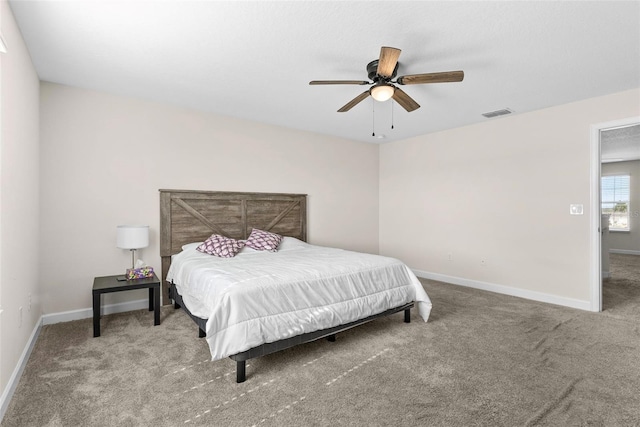 740 Simone Ct, Haines City, FL 33844 - carpeted bedroom featuring visible vents, baseboards, and ceiling fan