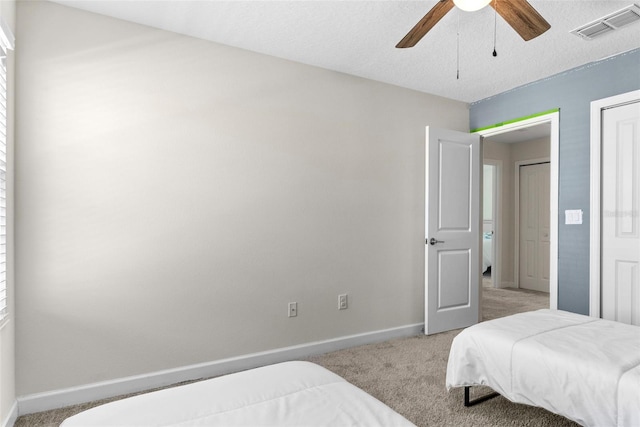 740 Simone Ct, Haines City, FL 33844 - bedroom with baseboards, light carpet, a ceiling fan, and visible vents