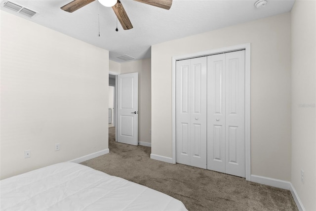 740 Simone Ct, Haines City, FL 33844 - bedroom featuring carpet floors, visible vents, a closet, baseboards, and ceiling fan