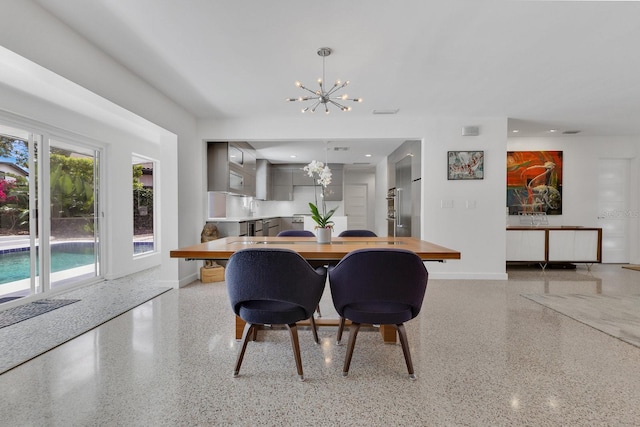 2525 Venetian Way, Winter Park, FL 32789 - dining room with an inviting chandelier, baseboards, and light speckled floor