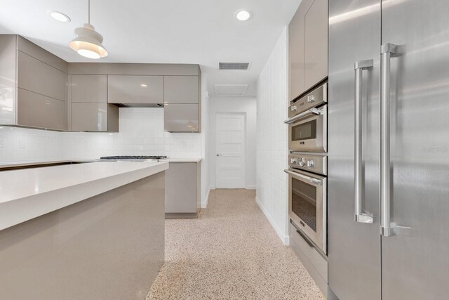 2525 Venetian Way, Winter Park, FL 32789 - kitchen featuring visible vents, modern cabinets, appliances with stainless steel finishes, backsplash, and gray cabinetry