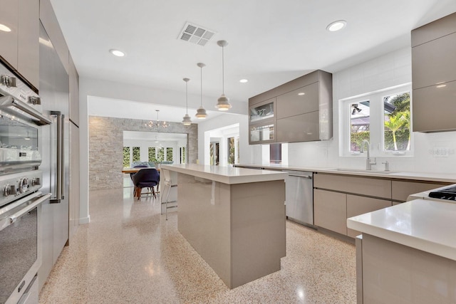 2525 Venetian Way, Winter Park, FL 32789 - kitchen with gray cabinets, visible vents, modern cabinets, stainless steel dishwasher, and a sink