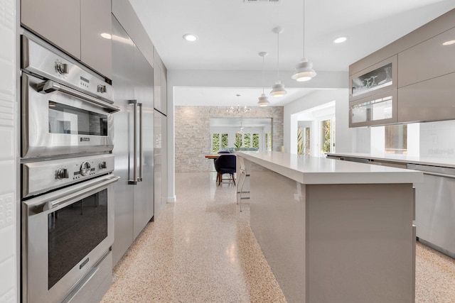 2525 Venetian Way, Winter Park, FL 32789 - kitchen featuring light countertops, modern cabinets, light speckled floor, and stainless steel appliances