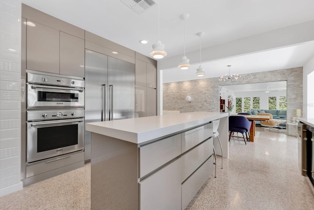 2525 Venetian Way, Winter Park, FL 32789 - kitchen featuring double oven, light countertops, gray cabinets, light speckled floor, and visible vents