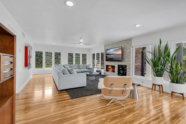 2525 Venetian Way, Winter Park, FL 32789 - living room featuring light wood-style floors, plenty of natural light, and a fireplace