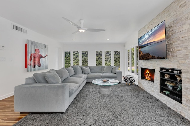 2525 Venetian Way, Winter Park, FL 32789 - living room featuring ceiling fan, a stone fireplace, visible vents, wood finished floors, and recessed lighting