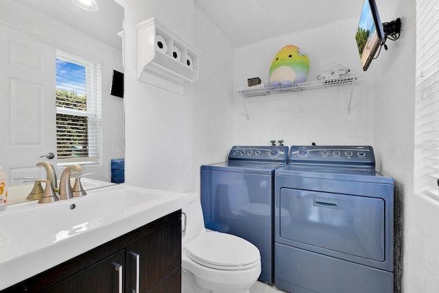 2525 Venetian Way, Winter Park, FL 32789 - clothes washing area featuring separate washer and dryer, laundry area, and a sink