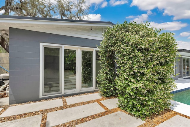 2525 Venetian Way, Winter Park, FL 32789 - view of home's exterior with concrete block siding and an outdoor pool