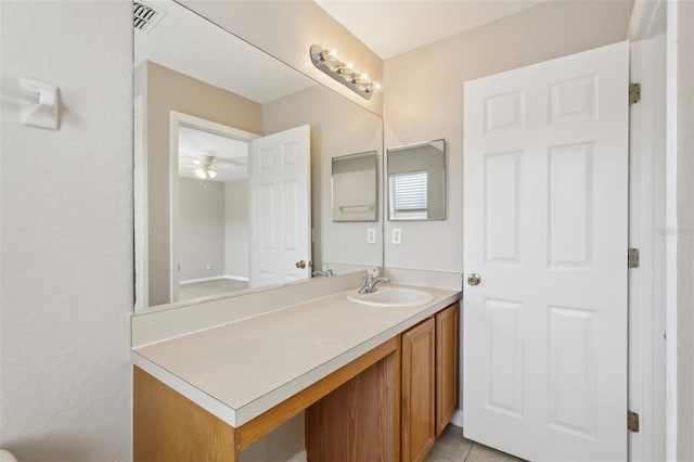 bathroom with a ceiling fan, visible vents, tile patterned flooring, and vanity
