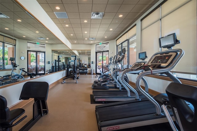 exercise room featuring visible vents, recessed lighting, and a paneled ceiling