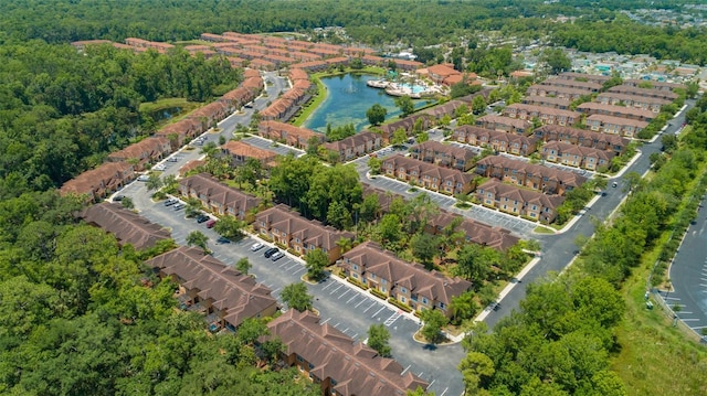 bird's eye view featuring a water view and a view of trees