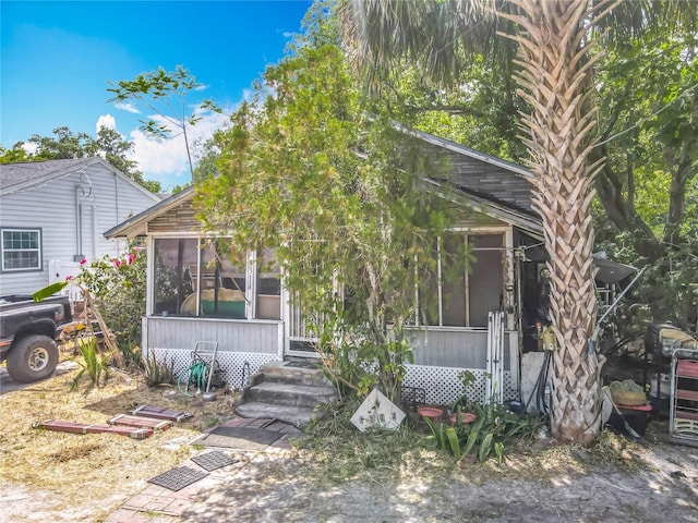 1314 S Mellonville Ave, Sanford, FL 32771 - view of front of home with a sunroom