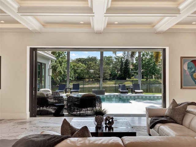 living area with beamed ceiling, coffered ceiling, and a wealth of natural light