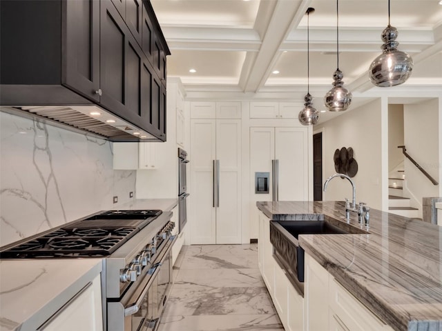 kitchen featuring light stone counters, a sink, marble finish floor, high end stove, and pendant lighting