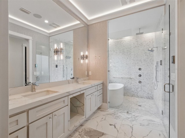 full bathroom with double vanity, a sink, a marble finish shower, and a freestanding bath