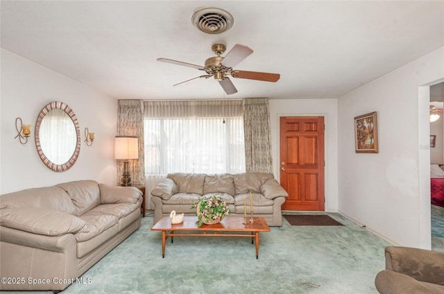 carpeted living area featuring a ceiling fan and visible vents