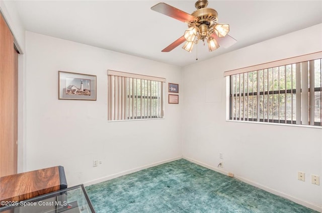 unfurnished room featuring baseboards, carpet flooring, and ceiling fan