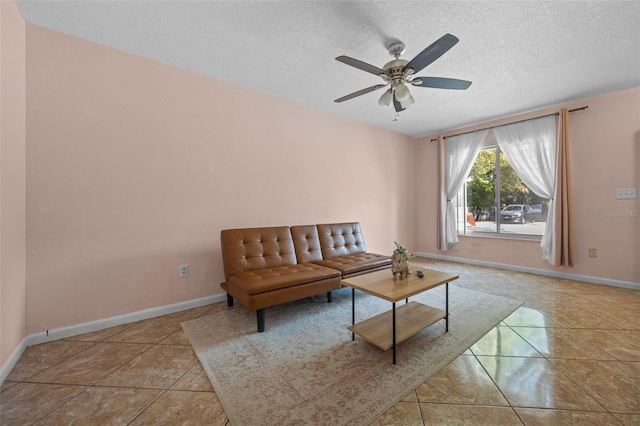 130 Kristi Ann Ct, Winter Springs, FL 32708 - tiled living area with baseboards, a textured ceiling, and ceiling fan