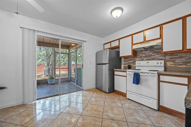 130 Kristi Ann Ct, Winter Springs, FL 32708 - kitchen with white cabinets, white range with electric cooktop, freestanding refrigerator, backsplash, and under cabinet range hood