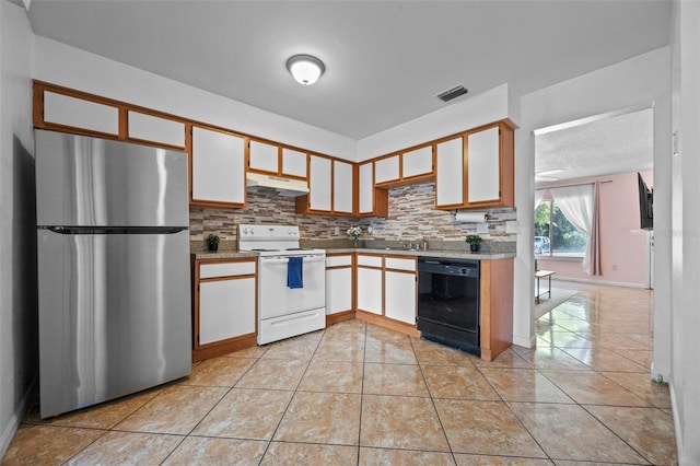 130 Kristi Ann Ct, Winter Springs, FL 32708 - kitchen with visible vents, black dishwasher, freestanding refrigerator, white range with electric stovetop, and under cabinet range hood