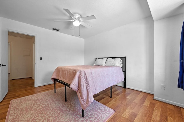 130 Kristi Ann Ct, Winter Springs, FL 32708 - bedroom with baseboards, a ceiling fan, wood finished floors, and visible vents