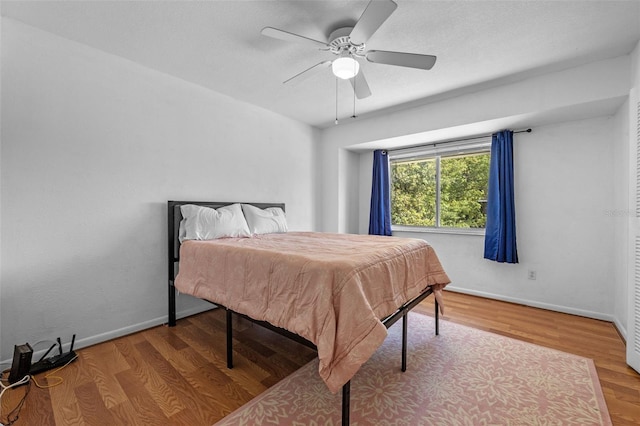 130 Kristi Ann Ct, Winter Springs, FL 32708 - bedroom with a ceiling fan, baseboards, and wood finished floors