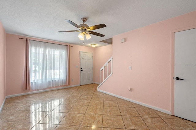 130 Kristi Ann Ct, Winter Springs, FL 32708 - empty room with a ceiling fan, stairs, and a textured ceiling