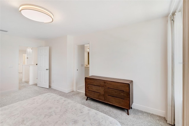 carpeted bedroom with baseboards