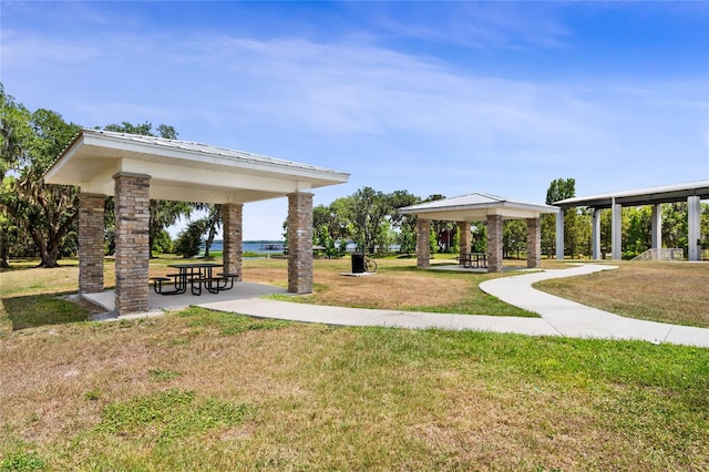 view of property's community featuring a lawn and a gazebo