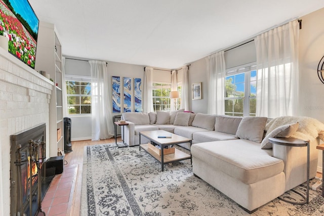 living area featuring tile patterned floors and a fireplace