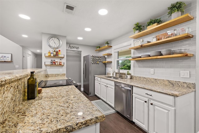 kitchen with visible vents, open shelves, a sink, white cabinets, and stainless steel appliances