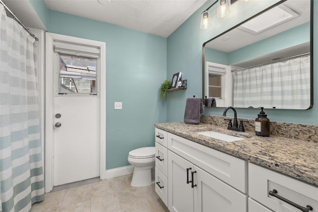 bathroom featuring vanity, baseboards, a shower with curtain, and toilet
