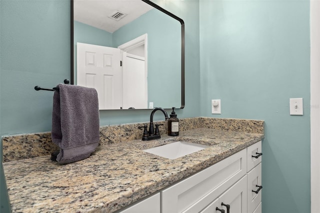 bathroom featuring visible vents and vanity