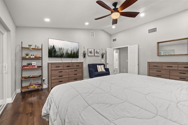 bedroom featuring vaulted ceiling, dark wood finished floors, and visible vents