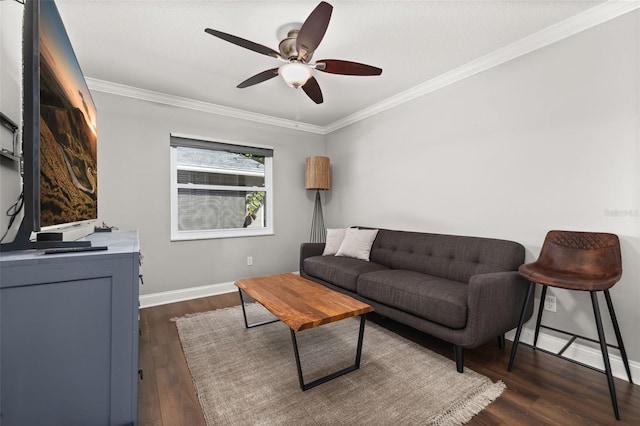 living room featuring ceiling fan, dark wood finished floors, ornamental molding, and baseboards