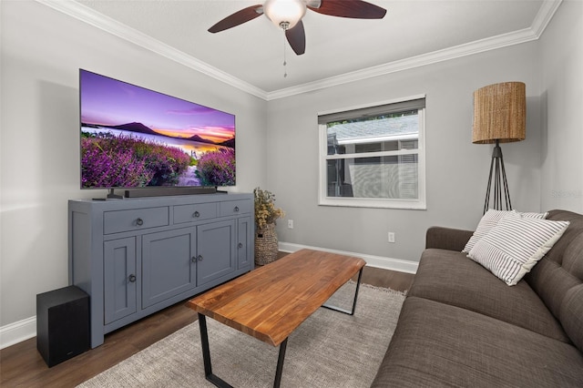 living room featuring crown molding, baseboards, ceiling fan, and dark wood-style flooring