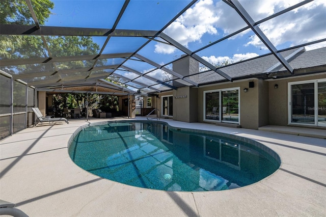 outdoor pool featuring a lanai and a patio area